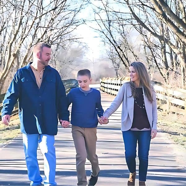 blogger, her husband and son walking down a path