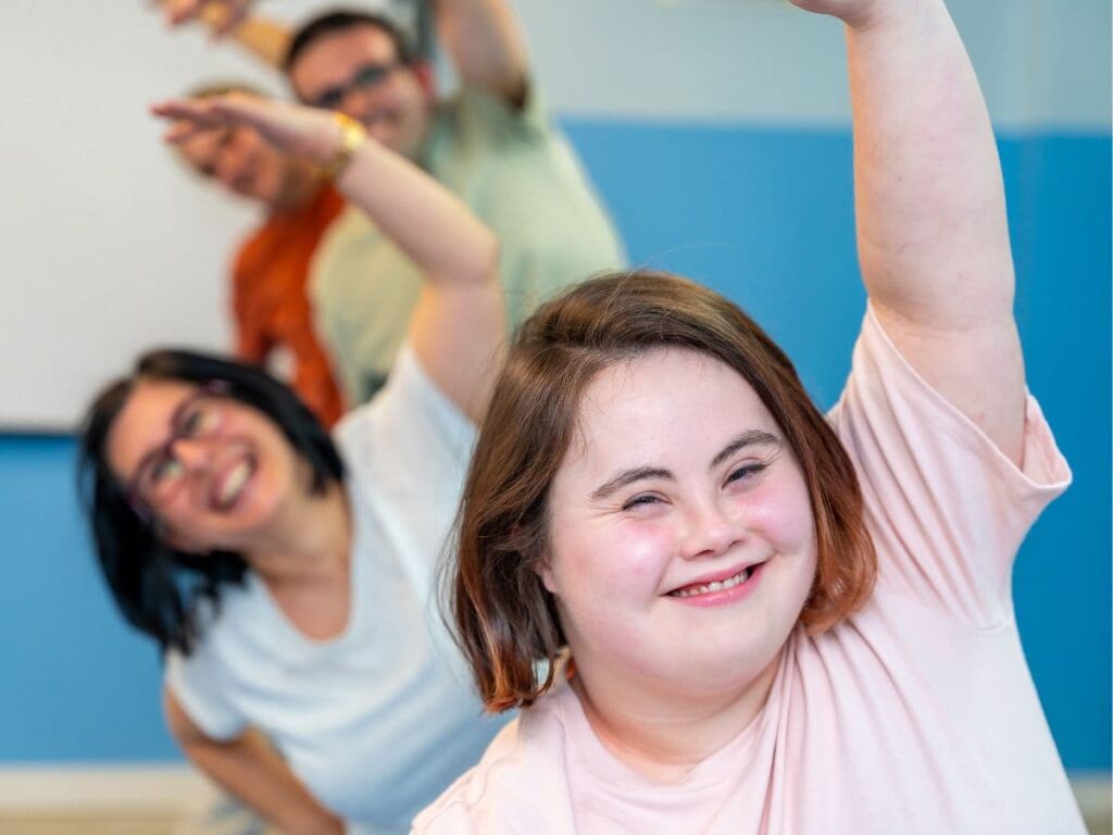 happy people with developmental disabilities exercising 